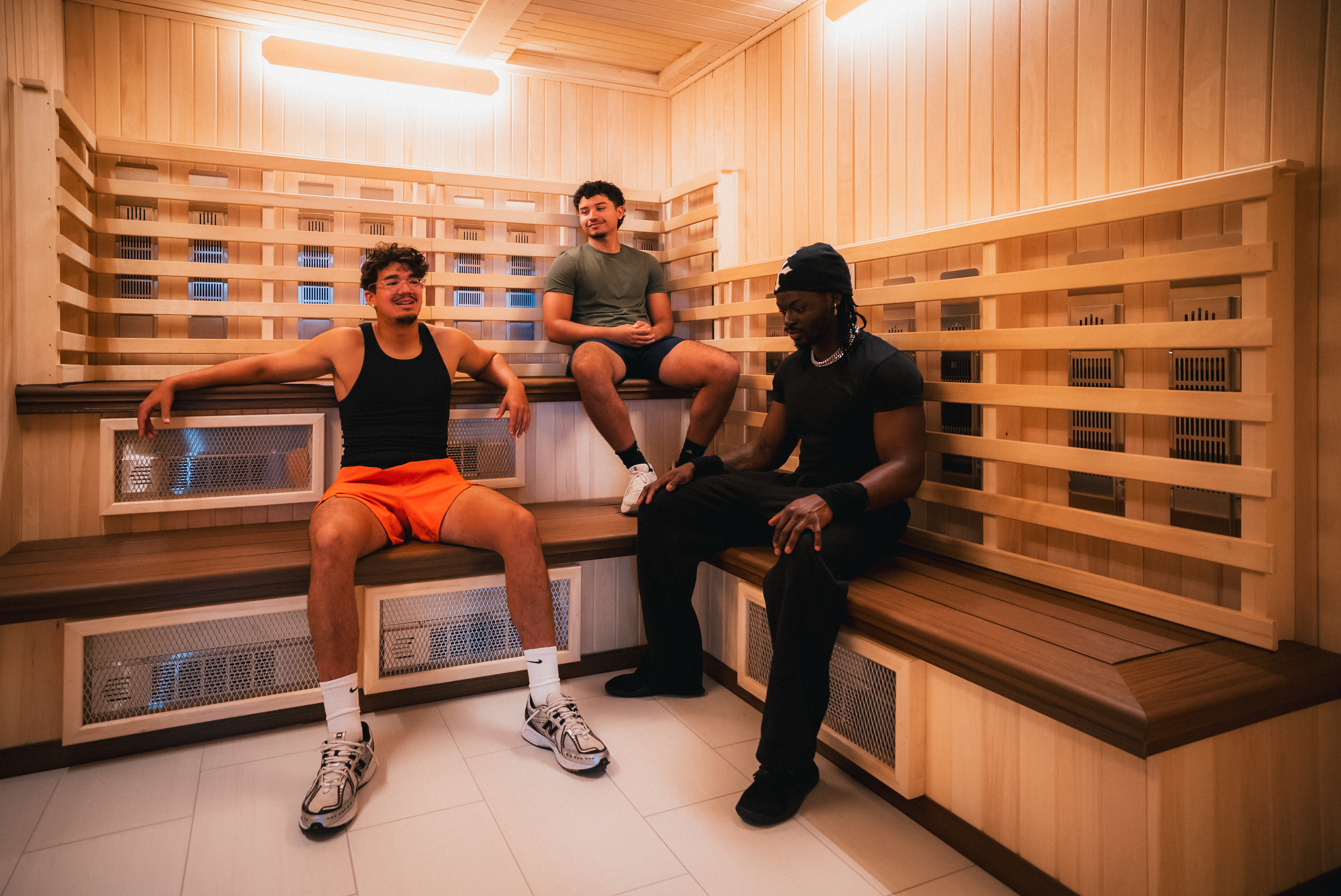 Member relaxing in a dry heat sauna